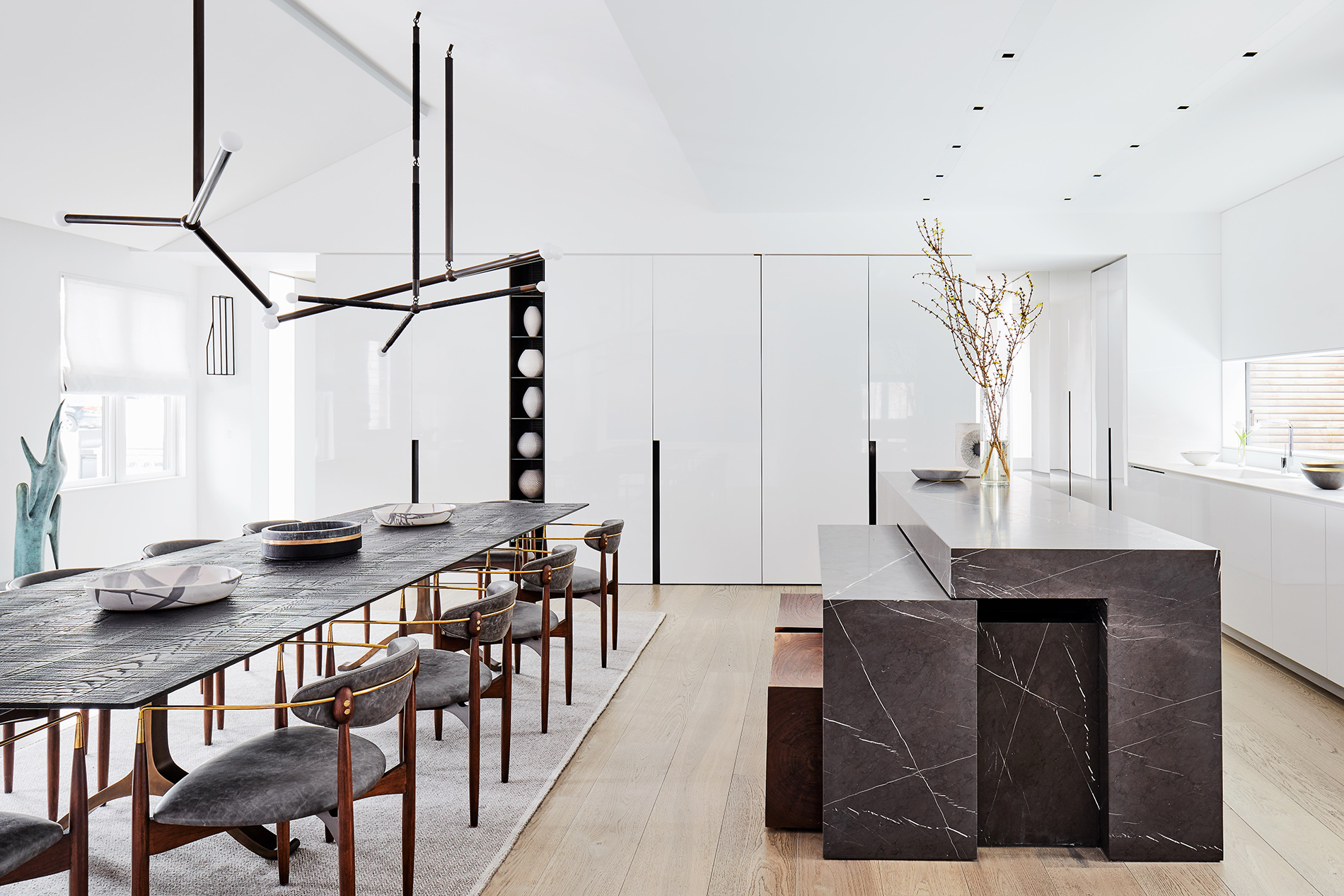 A black marble island slides out to reveal counter seating